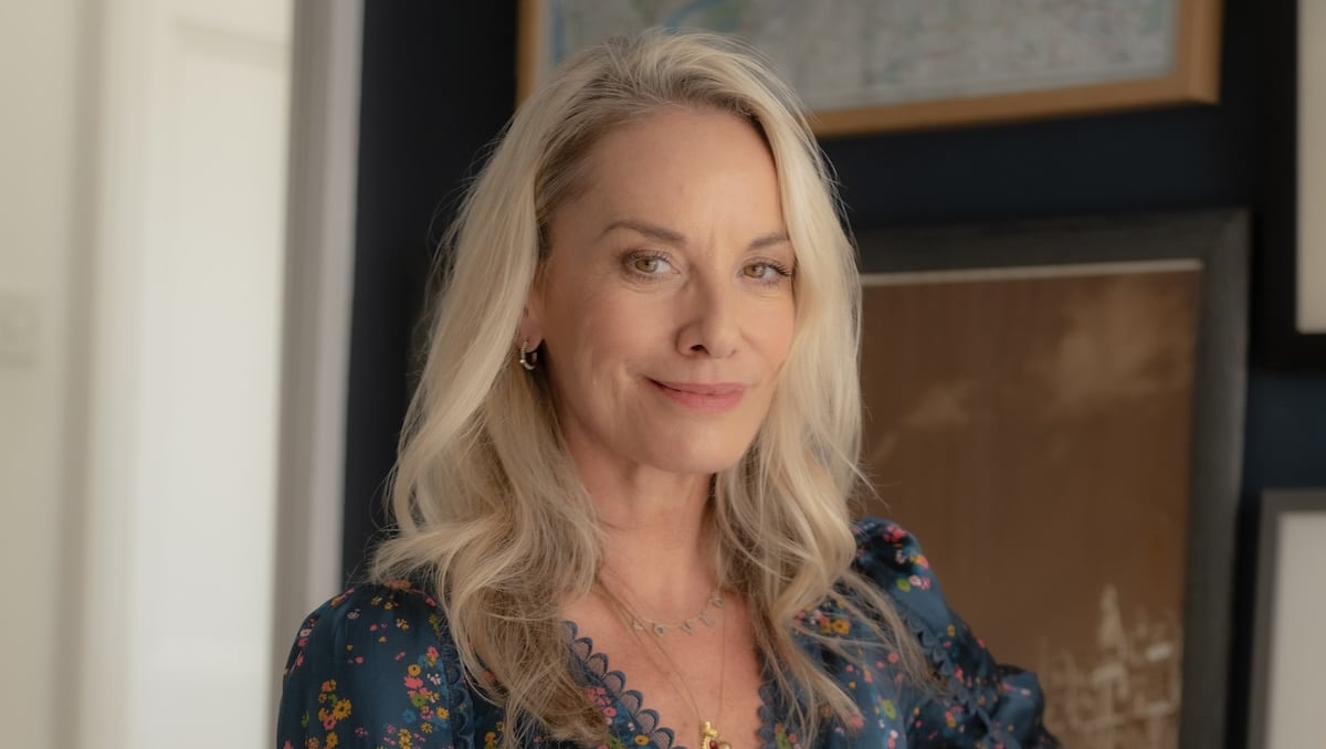 Tamzin Outhwaite smiling in a blue floral dress